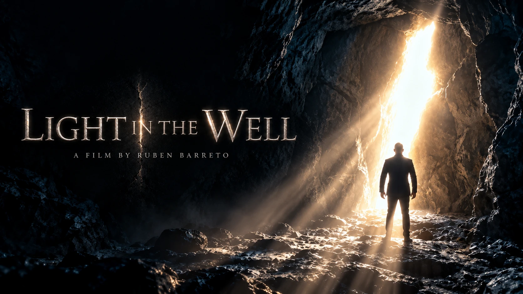 Light in the Well film poster showing a figure standing in a cave facing a bright opening